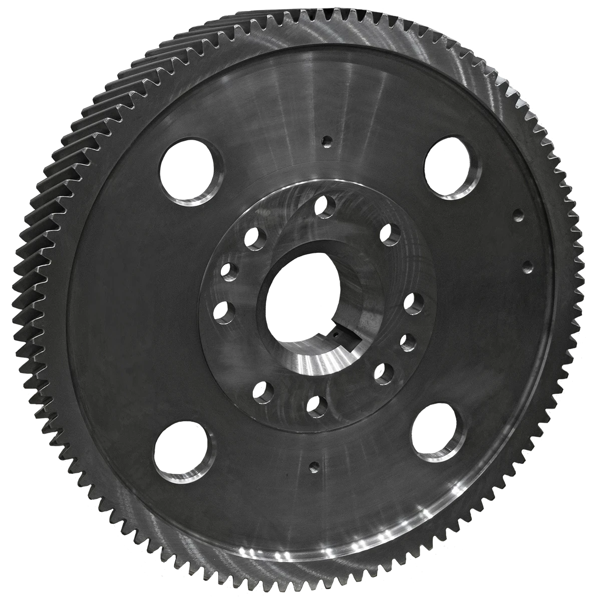 Large metal flywheel with gear teeth around the edge and multiple bolt holes in the center